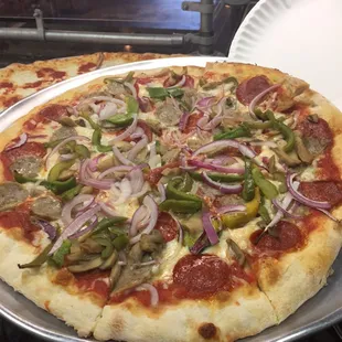 10&quot; Pie w/ Pepperoni, Sausage, Onions, Green Peppers, Mushrooms and a pinch of Fresh Garlic!