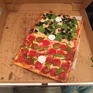 Sicilian pizza to go; half spinach/black olive and half pepperoni/green pepper