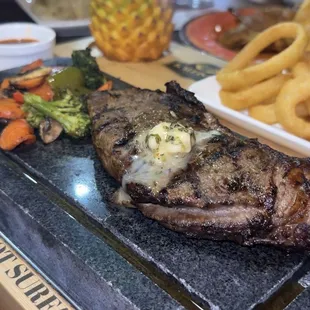 steak with butter and broccoli