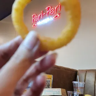 a hand holding a piece of food