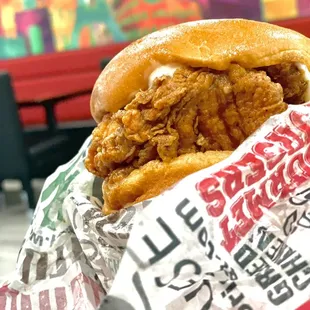 a chicken sandwich wrapped in a wrapper