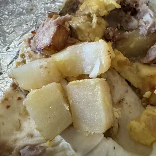 Hard undercooked potatoes and gross chicharrones