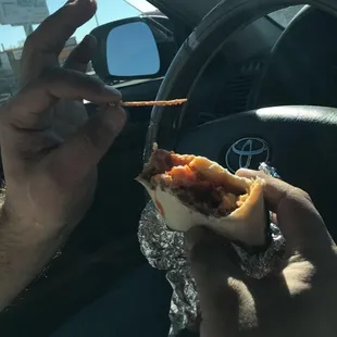 a person eating a hot dog