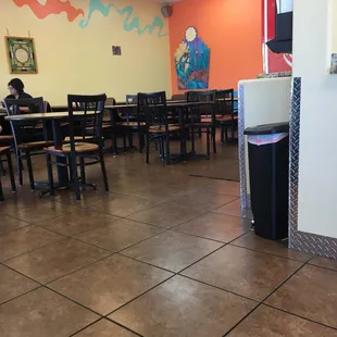 a restaurant with tables and chairs