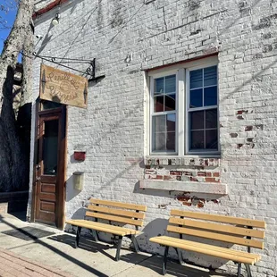 two benches in front of a building