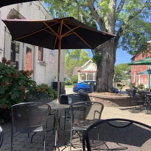 a patio with tables and chairs