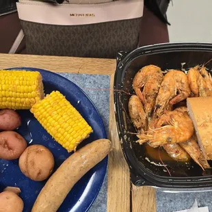 BBQ Shrimp with corn potatoes and sausage and french bread