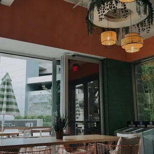 a dining area with a table and chairs