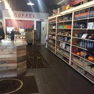 Counter and coffees and things for purchase.