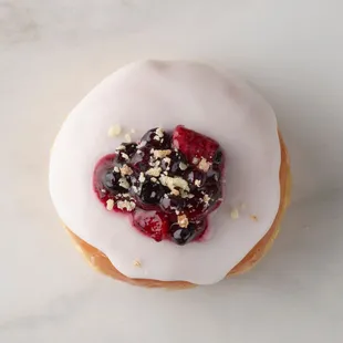 Wildberry Pie Donut - Raspberry-filled doughnut topped with vanilla frosting, a berry blend and crumbled pie crust.