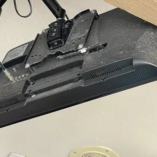 TV directly above our table covered in dust
