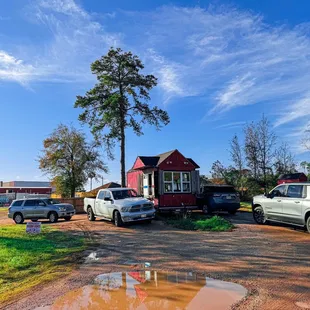 a group of cars parked in front of a house