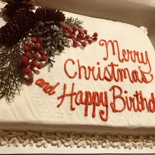 a christmas cake with the words merry christmas and happy birthday