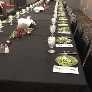 a long table set for a formal dinner