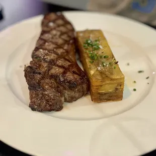 NY strip with potatoes pavé