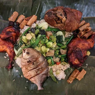 a plate of food on a banana leaf