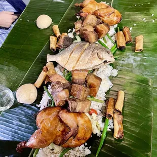 Kamayan feast  - Whole Fried Pompano  - Pinakbet  - Garlic Fried Rice  - Lechon Kawali  - Chicken Inasal  - Chocolate Coconut Budino