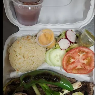 a meal in a styrofoam container