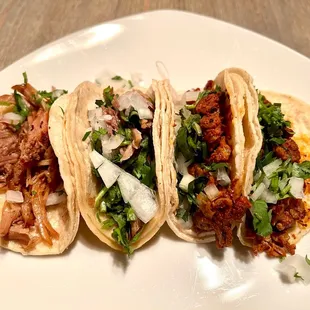 Carnitas Tacos (left two). Al Pastor Tacos (right two).