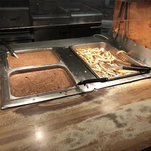 Self services hot French fry&apos;s beans or cowboy chili