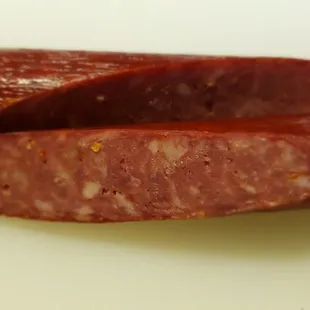 sliced sausage on a cutting board