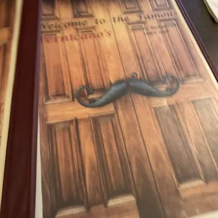 a moustache on a door