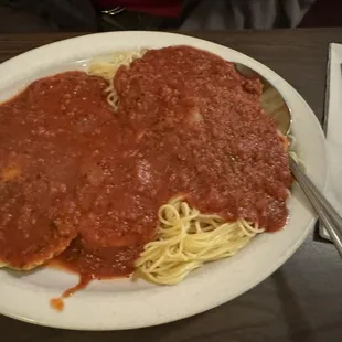 Half and Half Pasta spaghetti with meat sauce and spinach ravioli