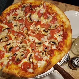 Large pepperoni, mushrooms and onions pizza