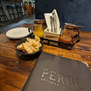 a table with a menu and plates of food