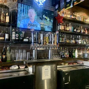 a bar with many bottles of alcohol