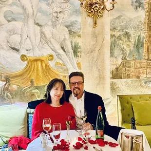 a man and a woman sitting at a table