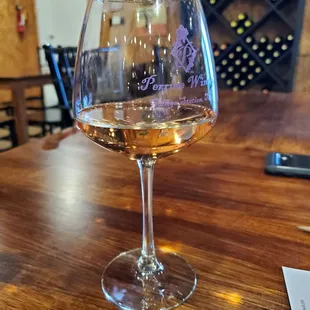 a glass of wine on a table