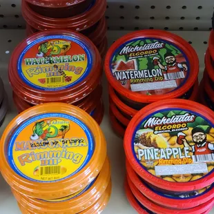 a display of various flavored drinks