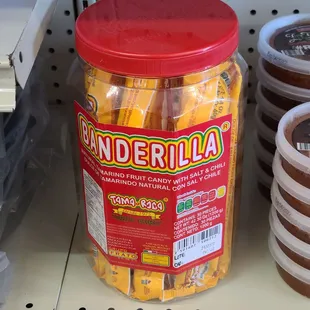 a jar of candies on a shelf
