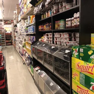 a grocery store aisle with a variety of products