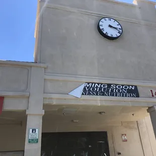 a clock on the side of a building