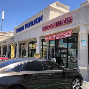a car parked in front of the store