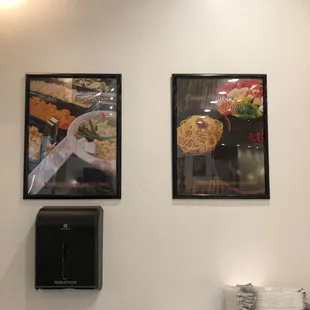 two framed pictures of food on a wall