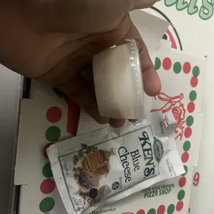 Tiny side of ranch and packaged blue cheese for over $2