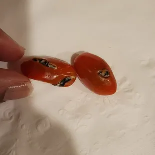 a person cutting tomatoes