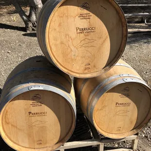 three barrels stacked on a pallet