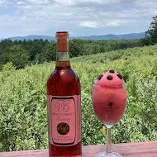 ows a glass of wine and a bottle of wine