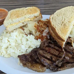 Steak and egg whites with home potatoes and sourdough bread. Yummy lunch.