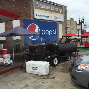 a car parked in front of a pepsi store