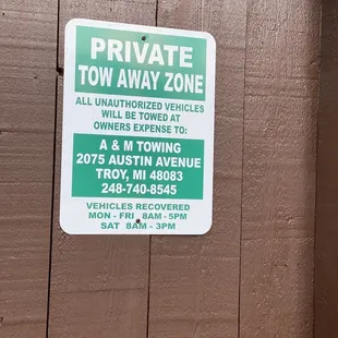 a private tow away zone sign