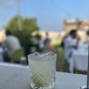 a glass of lemonade on a table