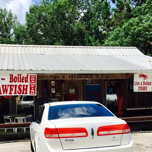 a car parked in front of a restaurant