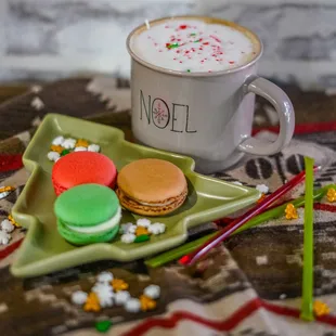 a cup of coffee and macarons