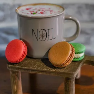 a cup of coffee and macarons