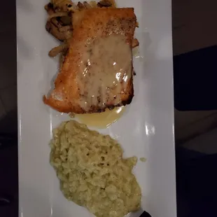 Standard menu Pan seares Salmon  with wild mushrooms risotto